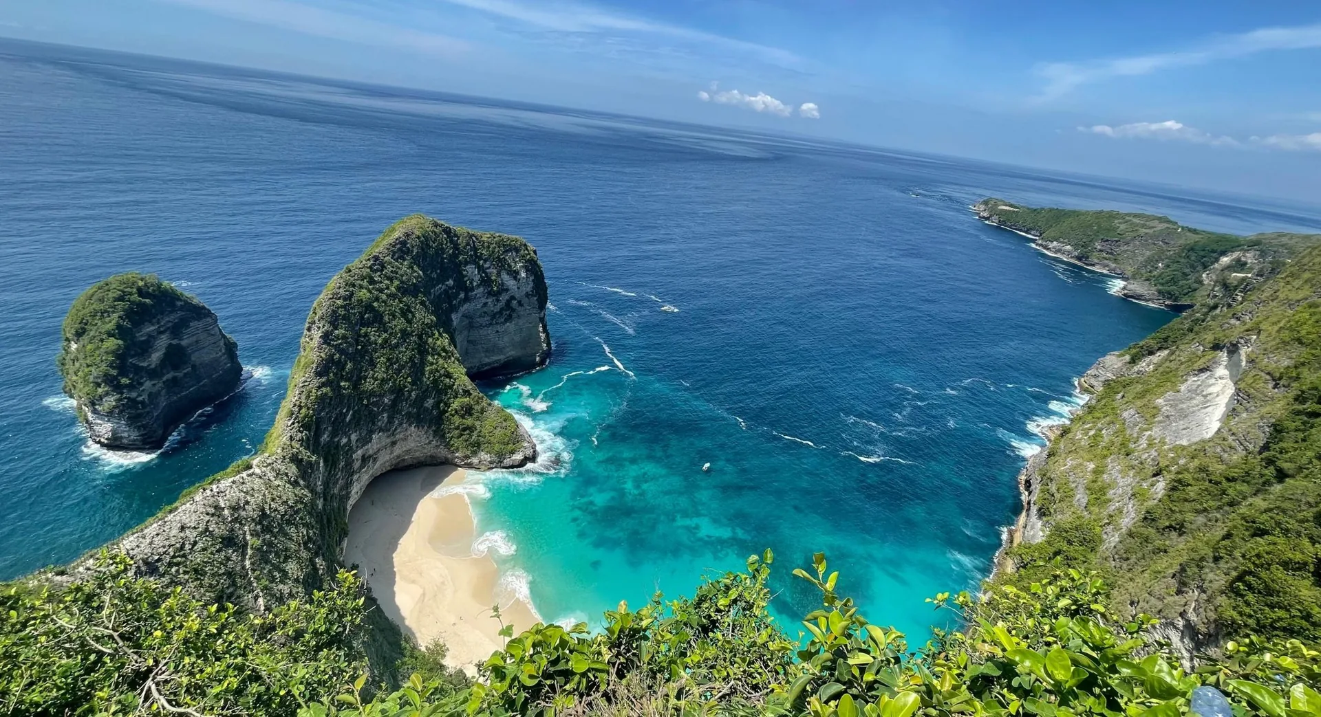 An aerial view of a cliff-backed cove
