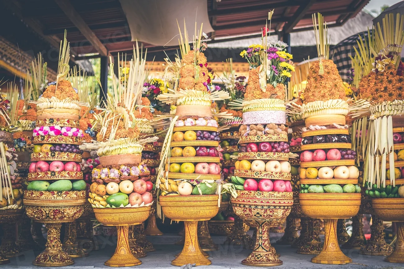 Stacked ceremonial offerings at a Balinese market